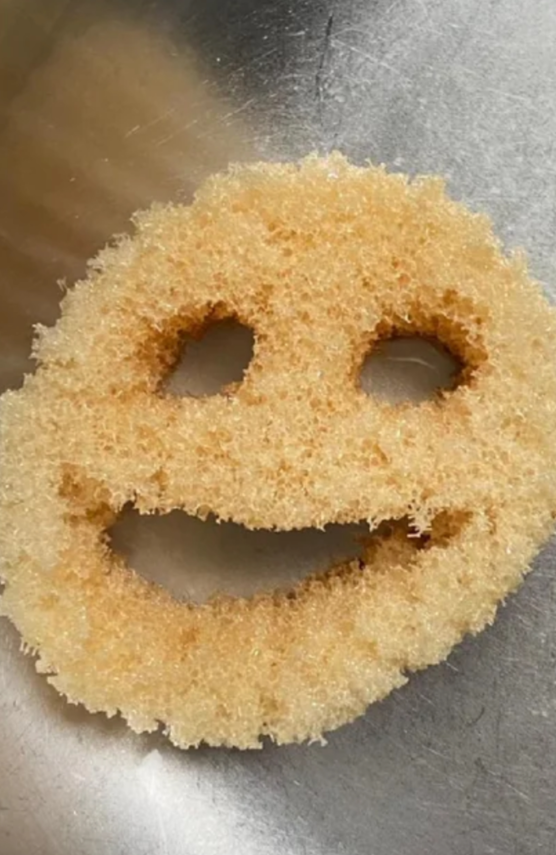 A used Scrub Daddy sponge
