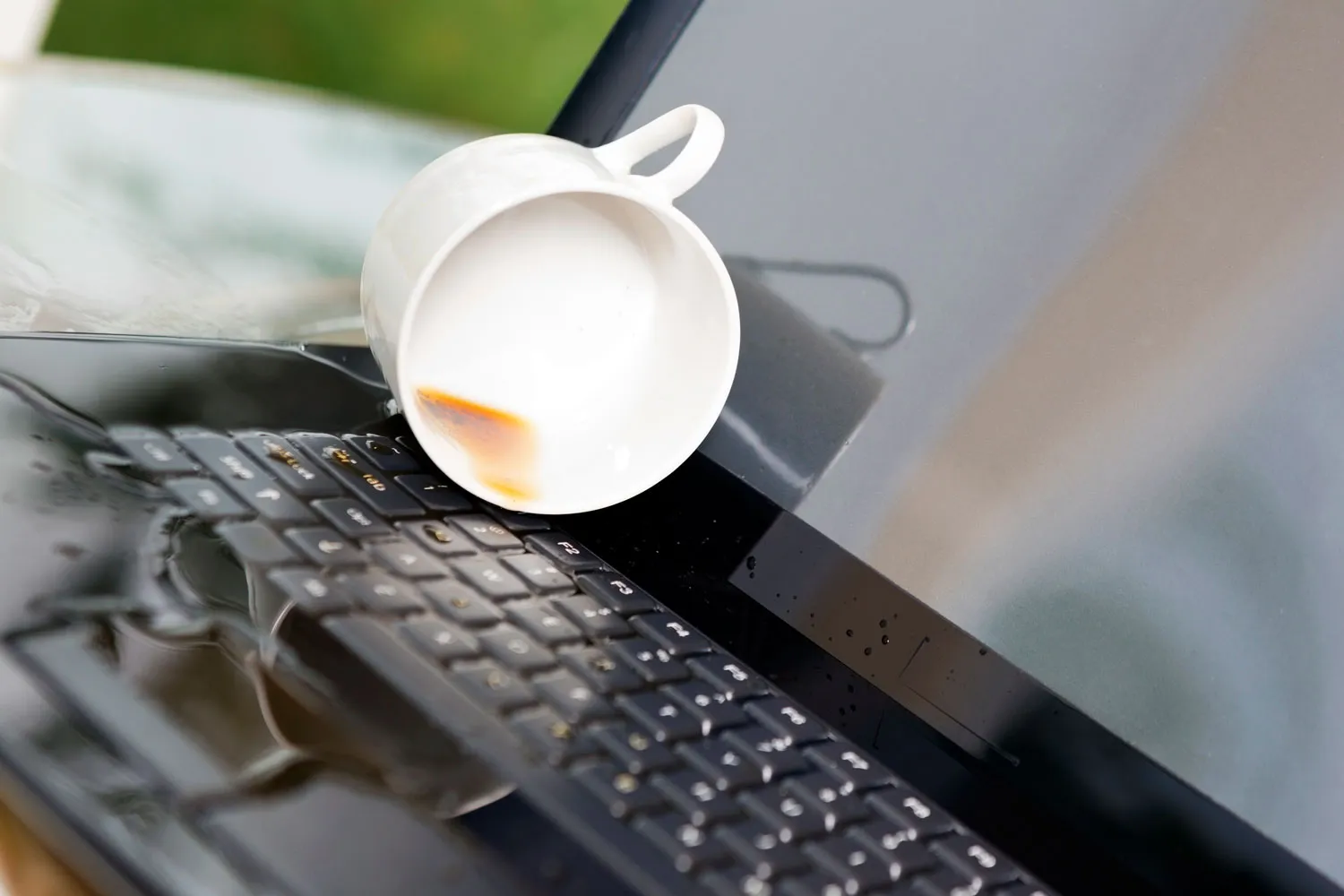 Spilling drink on laptop