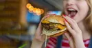 Girl Eating Large Hamburger